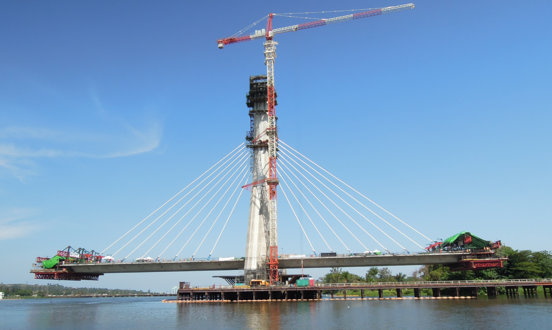 The bridge girder gradually extends, with the form traveler attached to the leading edge