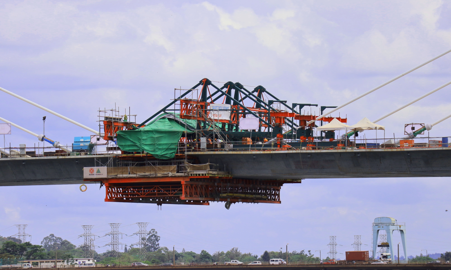 The left and right bridge girders are joined together in the final “closure” stage