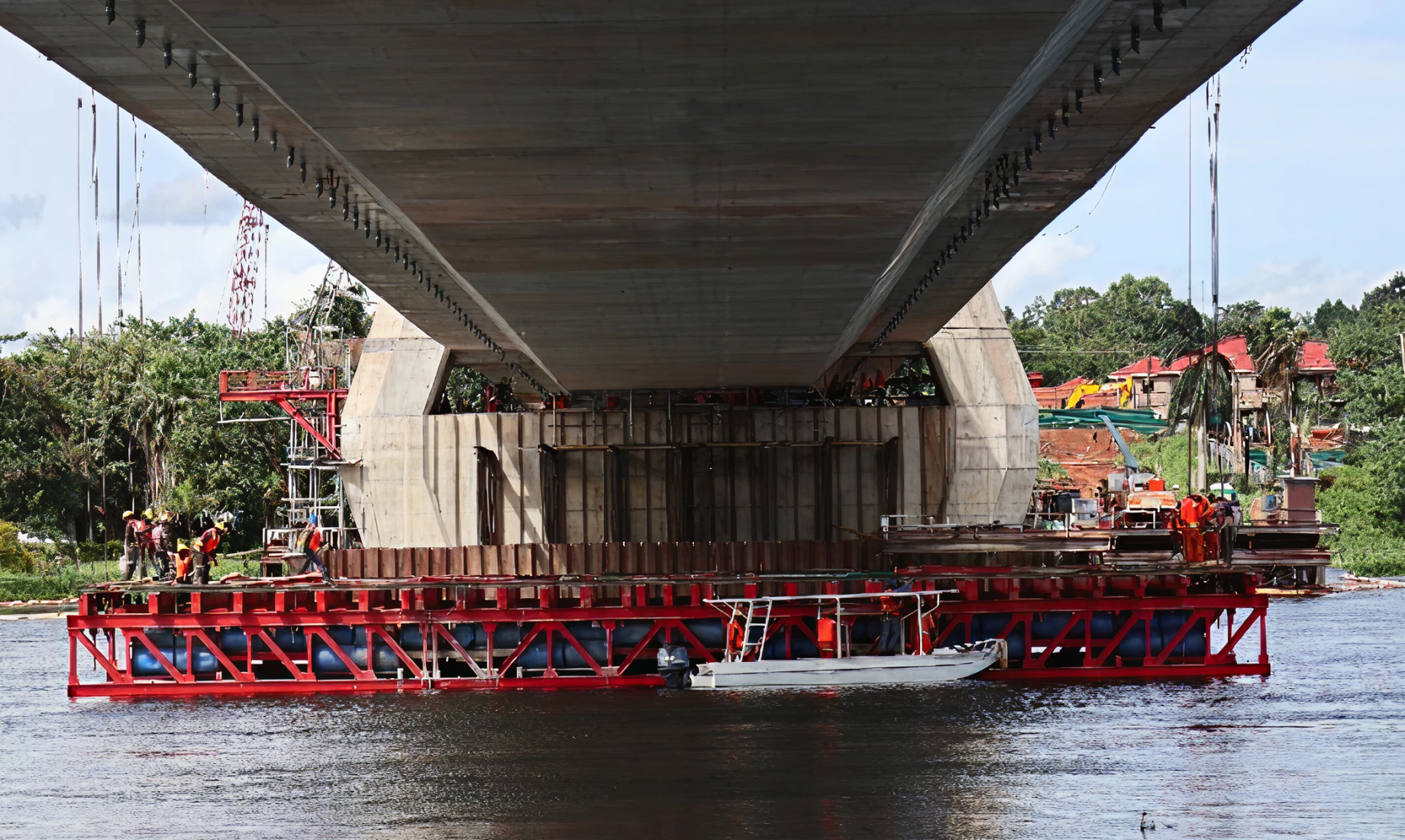 Finally, the form traveler is lowered onto the water surface and towed to shore
