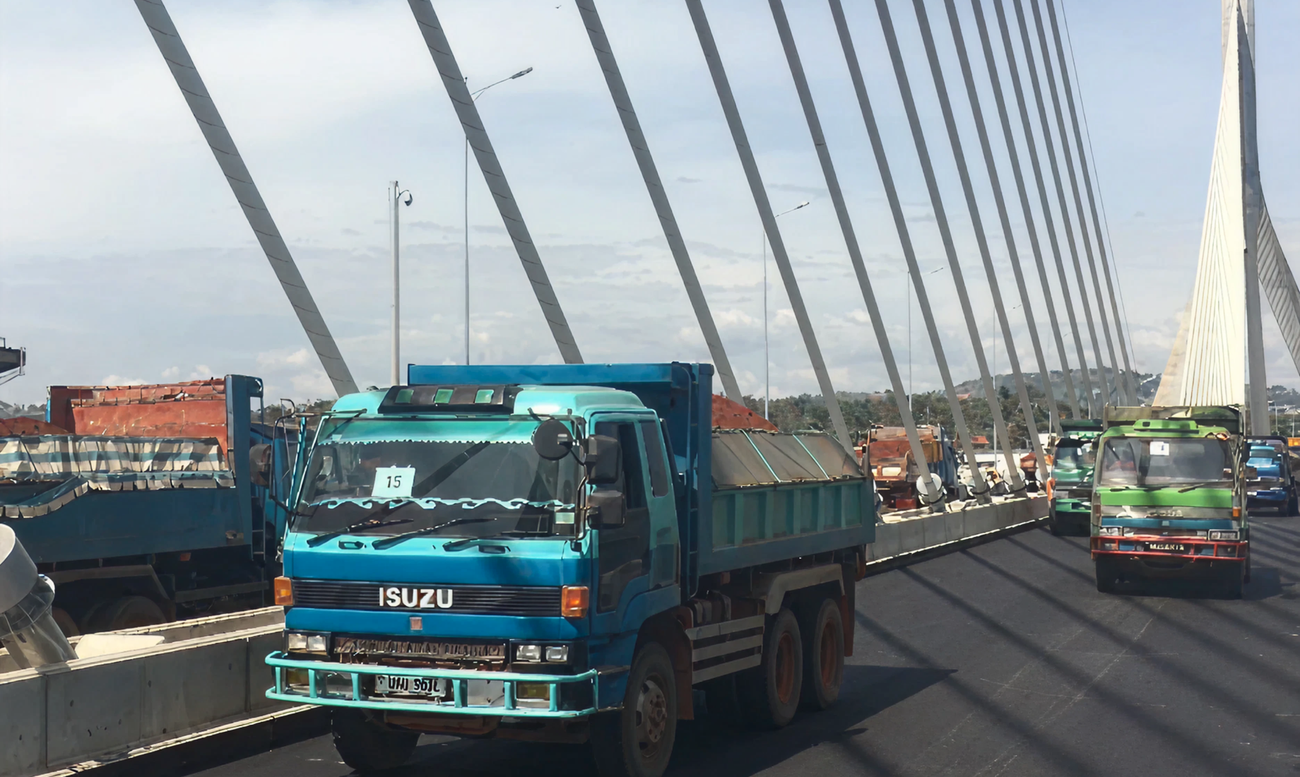 Load test: deflection is measured using dump trucks loaded with soil